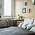 White city bicycle in bedroom with wooden wall